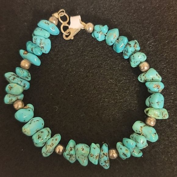 Jewelry - Genuine Turquoise Bracelet , 8 sterling silver beads embelish this bracelet